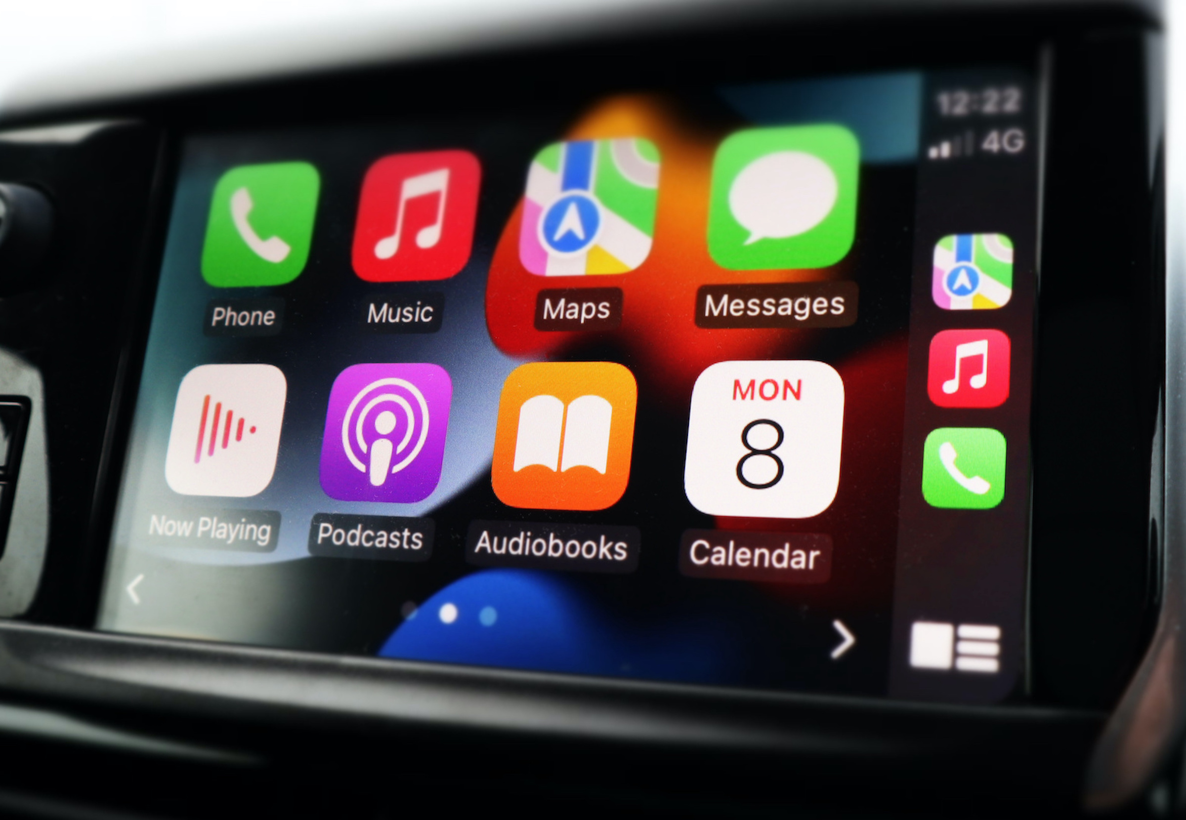 A photo of Apple Carplay with a prominent Podcast icon.